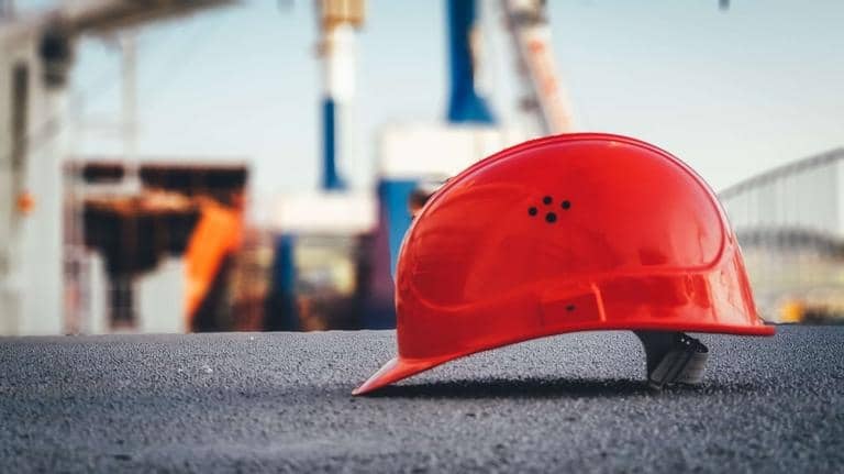 Red construction safety helmet symbolizing Heartland Building Group’s expertise, safety, and reliability on construction projects.