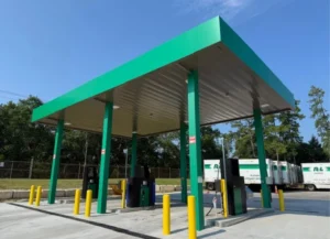 Completed fueling station canopy with fuel pumps built by Heartland Building Group